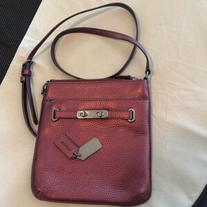Metallic red Coach crossbody bag